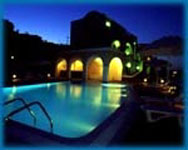 El Theon Apartment Santorini pool by night